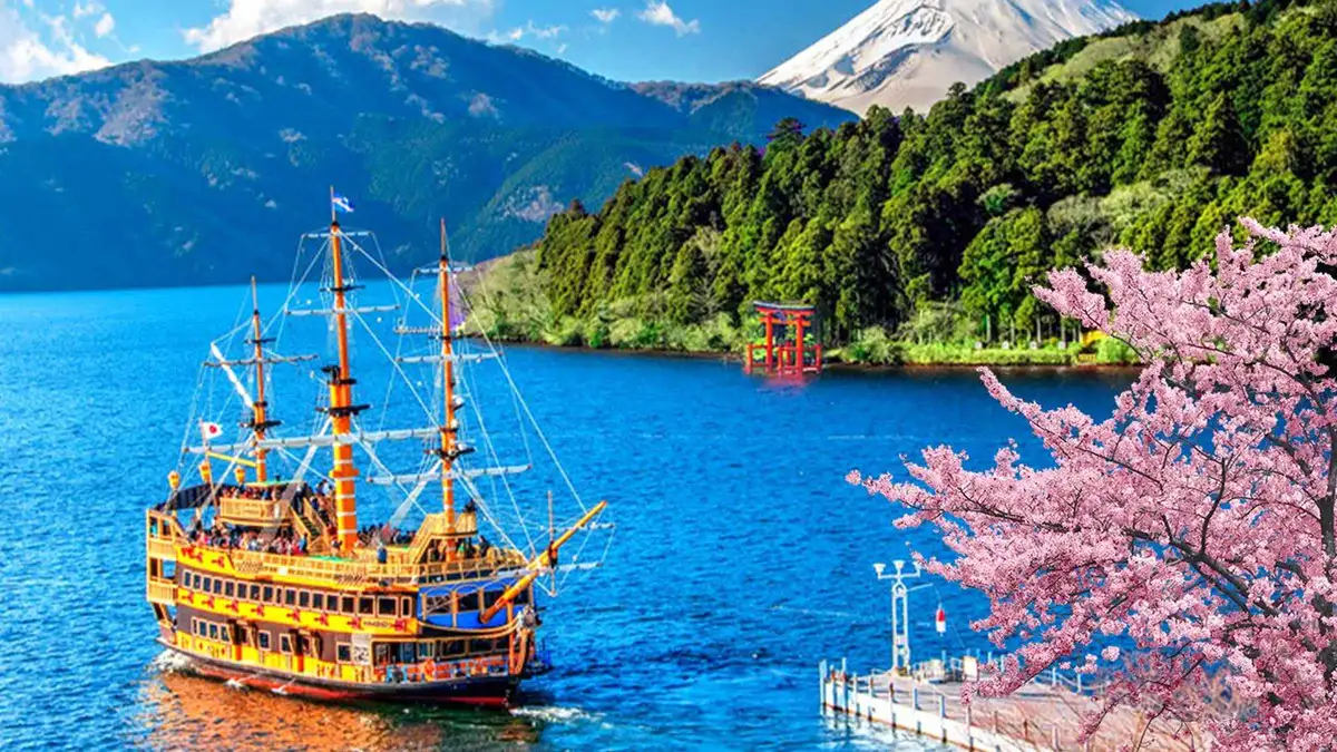 Pirate ship at Togendai pier on Lake Ashi with volcanic hillsides behind on a Lake Ashi cruise day tour, Hakone, Japan